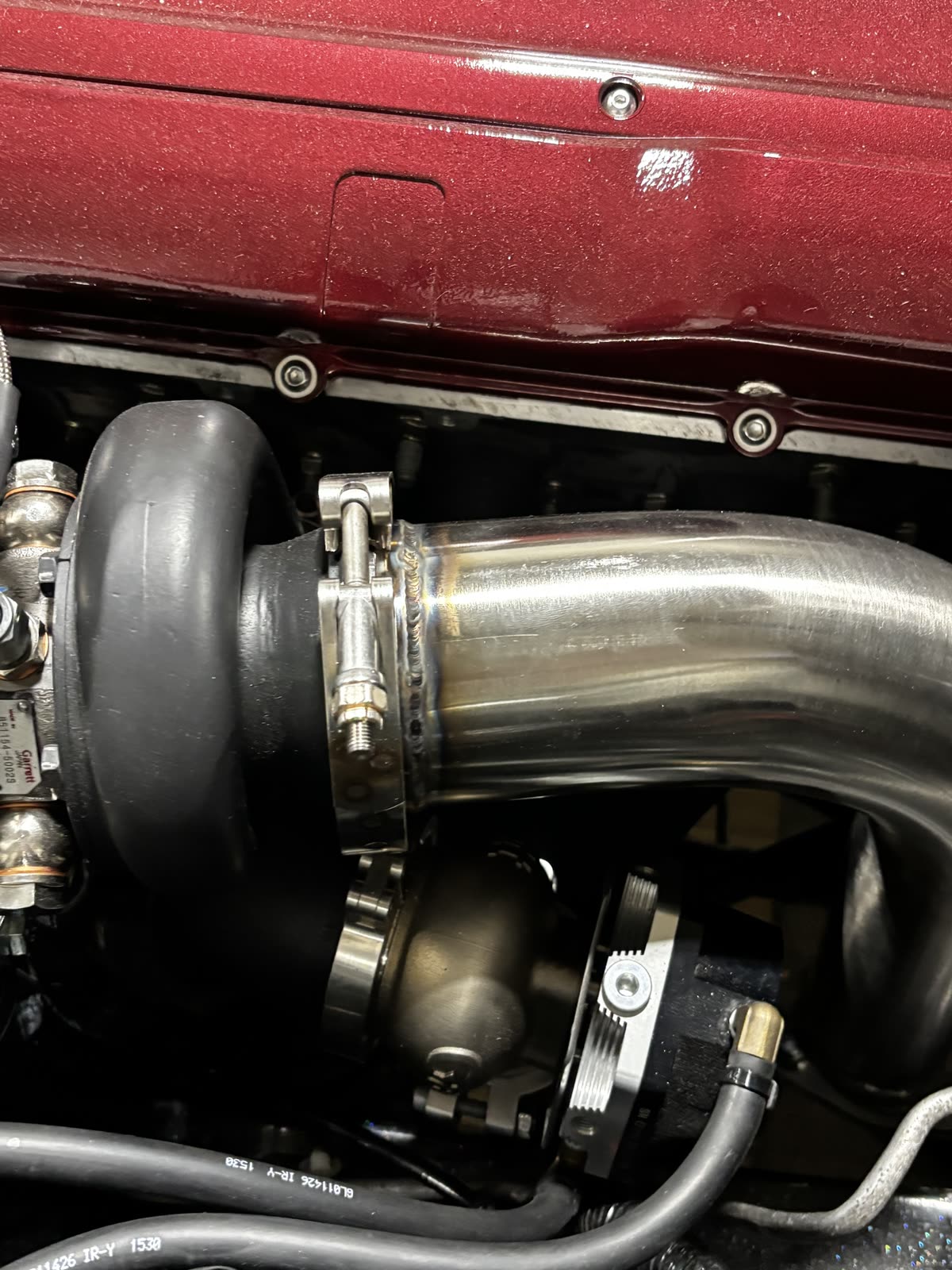 Close-up of the TIG weld where the downpipe meets the V-band flange